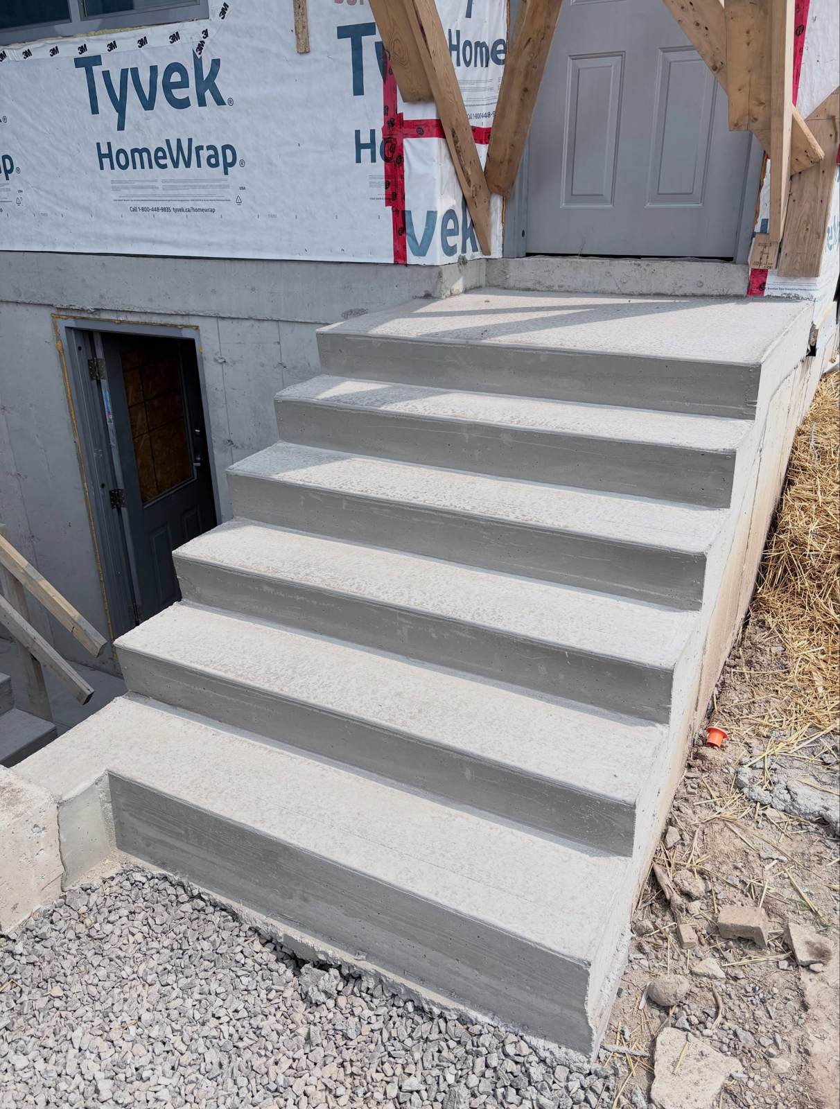 Finished concrete steps at the entrance of a newly built home