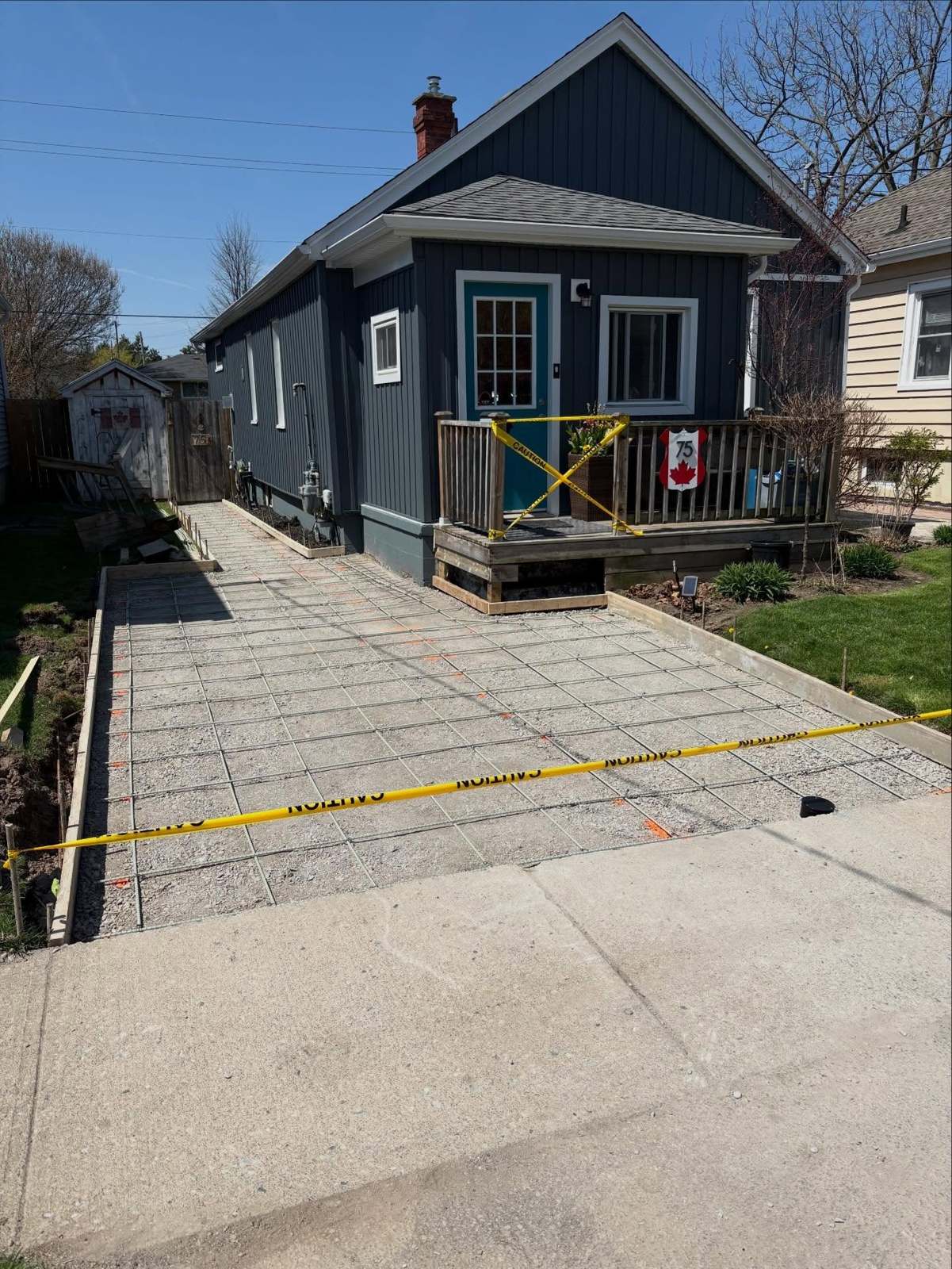 Driveway forms with rebar reinforcement laid out before the concrete pour